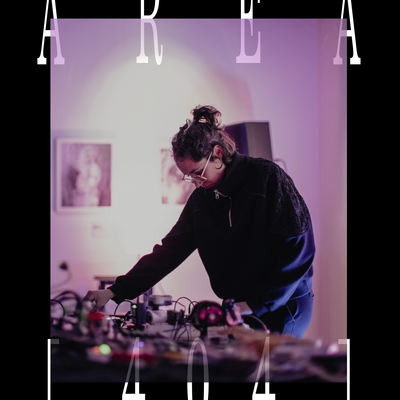Photo of woman leaning down towards mixing desk