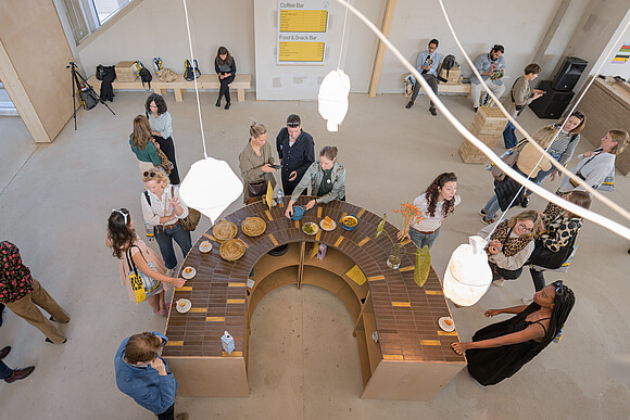 Food Innovation People standing around a table with food
