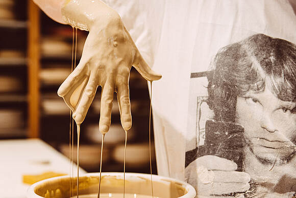 Wet clay runs from the hand Wet clay runs from the hand