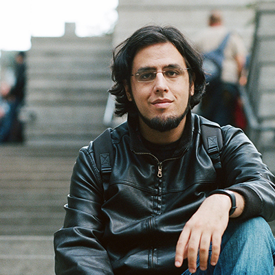 Young man with glasses and beard profile photo