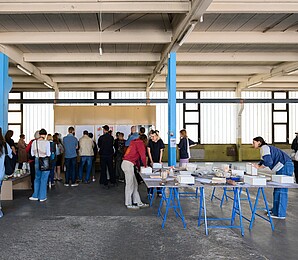 A group of people engaging in discussion at Biofabrique Vienna, Nordwestbahnhof.