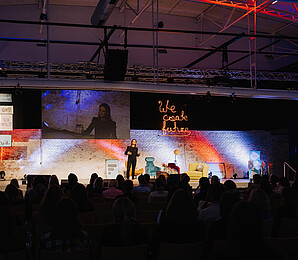 Photo of a woman on stage