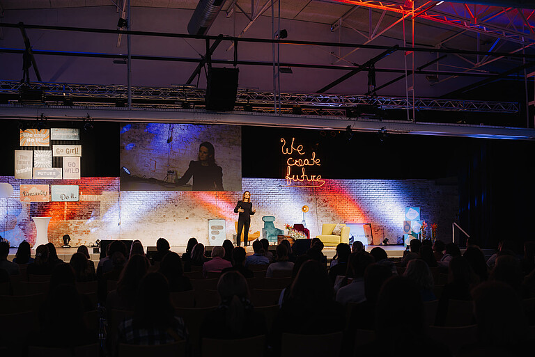 Photo of a woman on stage
