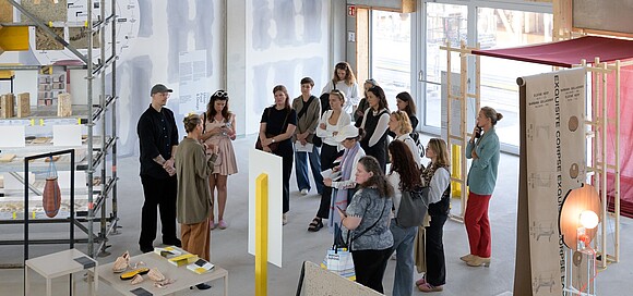 Group of people being guided through an exhibition