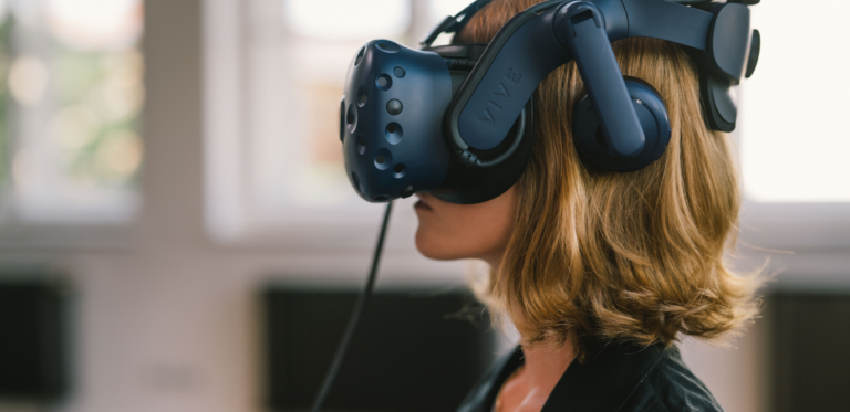 woman with red-blonde hair and VR glasses