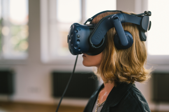 woman with red-blonde hair and VR glasses