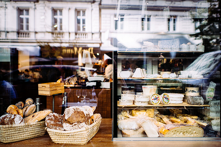 Bread and cheese on display in a grocery shop