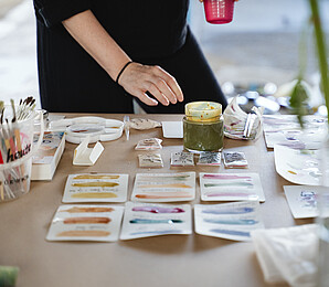 person experimenting with the “Wiener Farben” palette on paper