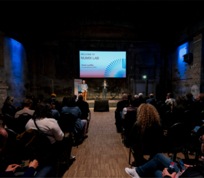 Lecture hall with speakers, audience and Screen "Numix Lab"