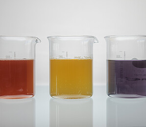 3 liquid color extracts in glass, red, yellow, purple